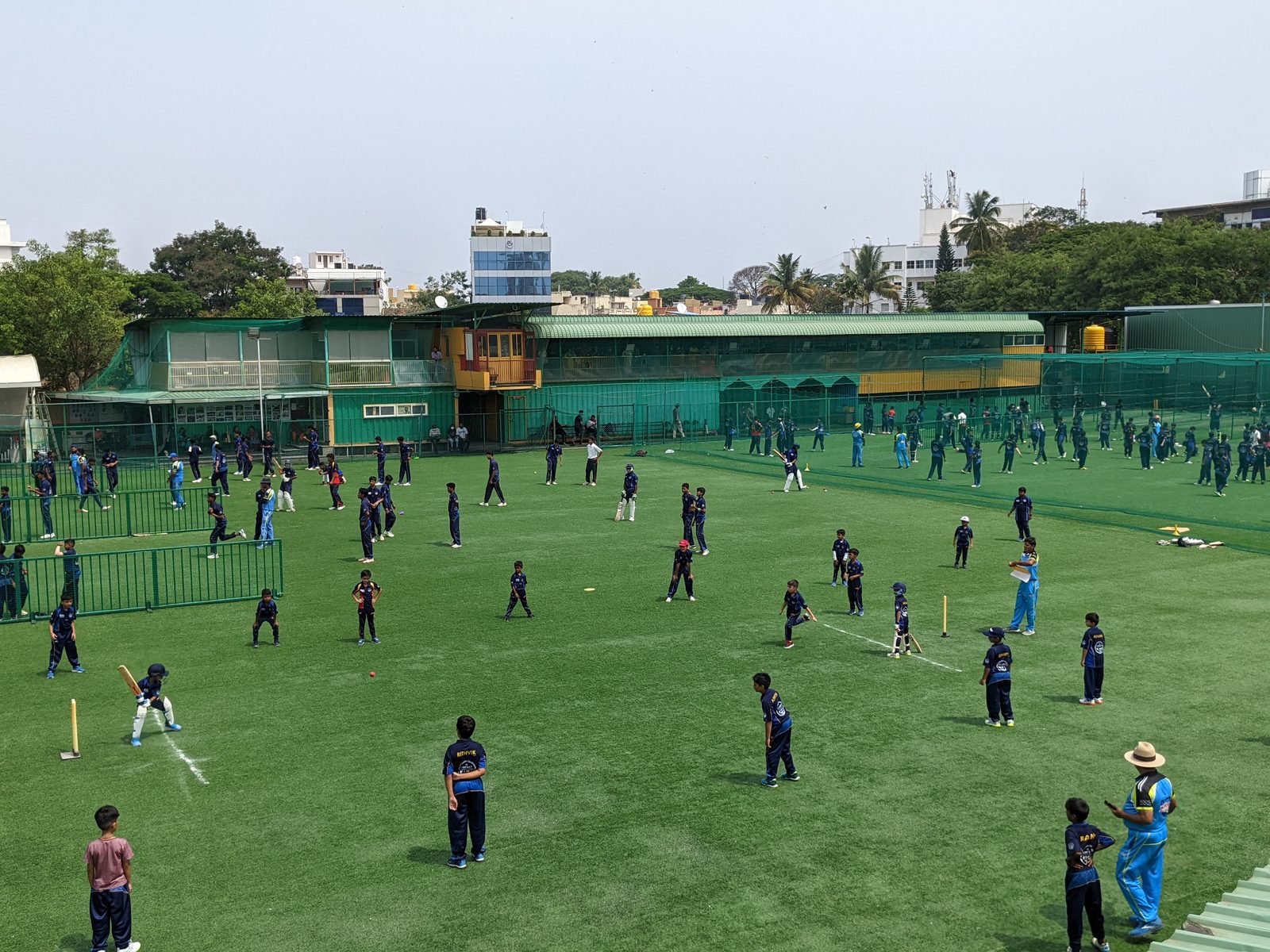 Players training across the grounds at KIOC, Bengaluru